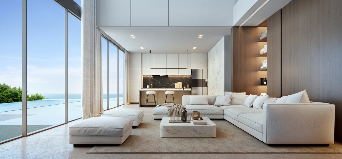 Luxury living room with white sofa and pool view